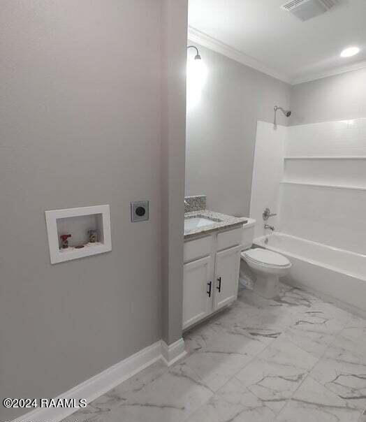400 S Granger St, Erath, LA 70533 - bathroom with ornamental molding, shower / bath combination, marble look tile flooring, vanity, and toilet