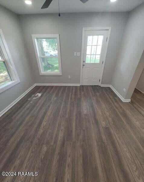 400 S Granger St, Erath, LA 70533 - doorway to outside with ceiling fan, dark wood-type flooring, baseboards, and recessed lighting