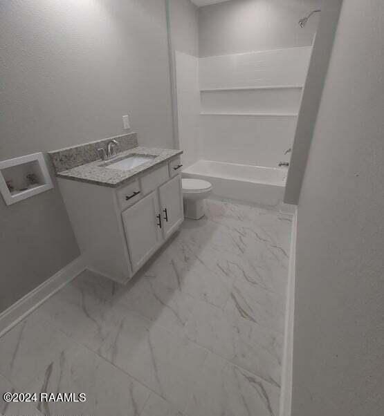 400 S Granger St, Erath, LA 70533 - full bathroom with marble finish floors, vanity, toilet, and washtub / shower combination