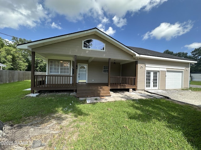 6033 Perry Ln, Lake Charles, LA 70605 - view of front of property with a garage, french doors, gravel driveway, and a porch