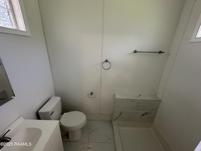 6033 Perry Ln, Lake Charles, LA 70605 - bathroom featuring marble finish floors, toilet, and vanity