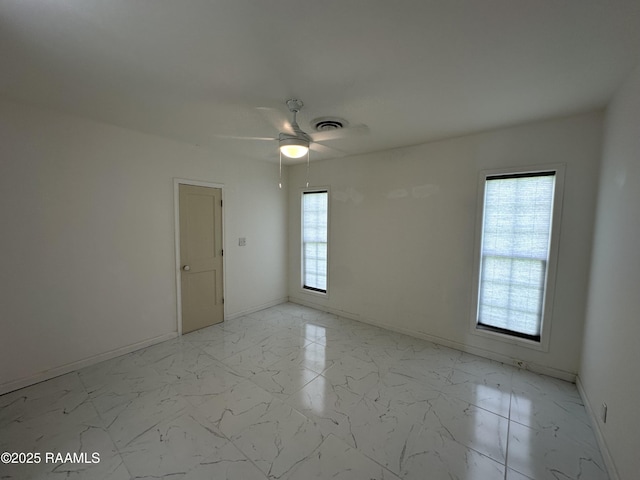 6033 Perry Ln, Lake Charles, LA 70605 - unfurnished room featuring ceiling fan, baseboards, and light marble finish floors