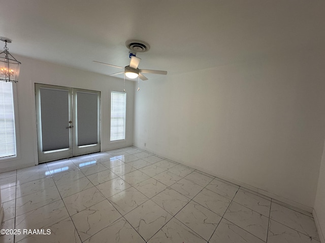 6033 Perry Ln, Lake Charles, LA 70605 - unfurnished room featuring light marble finish flooring, ceiling fan, and plenty of natural light