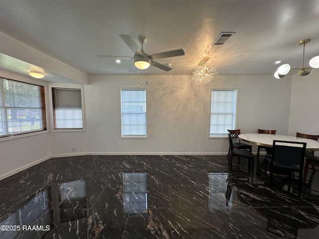 6033 Perry Ln, Lake Charles, LA 70605 - dining space featuring dark marble finish floors, healthy amount of natural light, a chandelier, baseboards, and recessed lighting