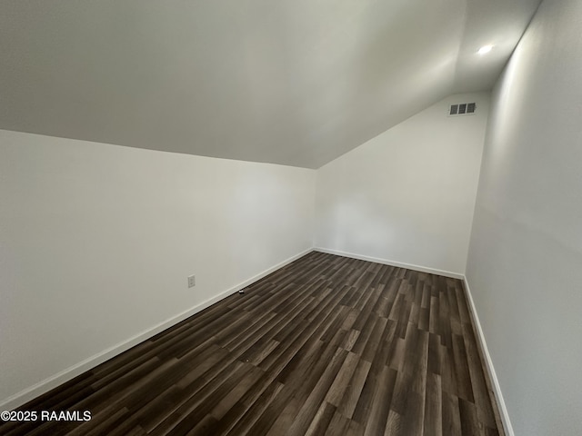 6033 Perry Ln, Lake Charles, LA 70605 - additional living space with lofted ceiling, dark wood-type flooring, baseboards, and recessed lighting