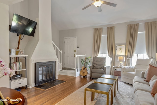 210 Long Plantation Blvd Unit C, Lafayette, LA 70508 - living room with wood finished floors, healthy amount of natural light, a ceiling fan, vaulted ceiling, and a glass covered fireplace
