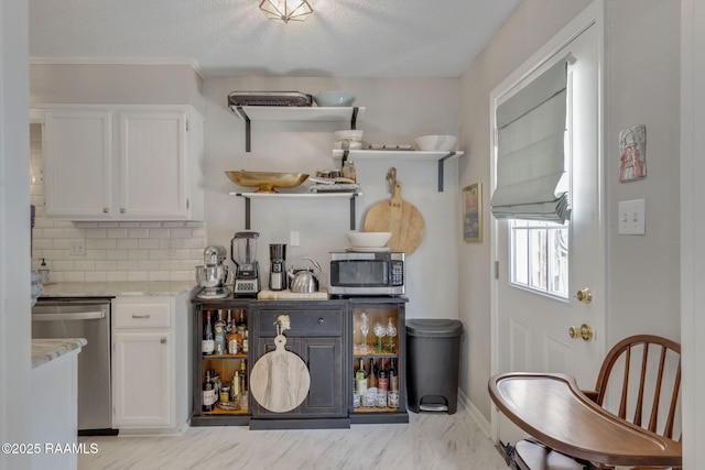 210 Long Plantation Blvd Unit C, Lafayette, LA 70508 - kitchen with open shelves, stainless steel appliances, white cabinetry, backsplash, and a textured ceiling