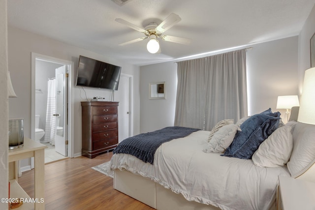 210 Long Plantation Blvd Unit C, Lafayette, LA 70508 - bedroom with light wood finished floors, a ceiling fan, and ensuite bath