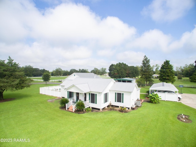 2944 Main Hwy, Breaux Bridge, LA 70517 - view of front facade featuring a front yard, covered porch, and metal roof