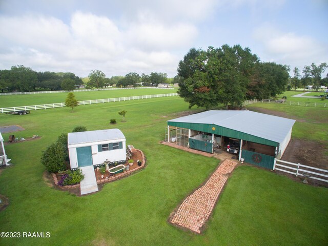 2944 Main Hwy, Breaux Bridge, LA 70517 - view of yard featuring a pole building, an outbuilding, a view of rural / pastoral area, and an exterior structure