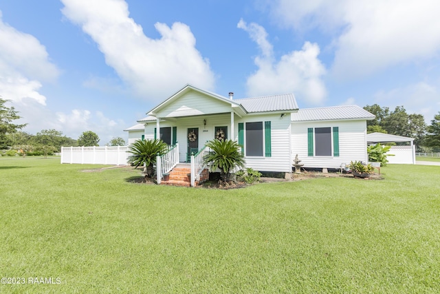 2944 Main Hwy, Breaux Bridge, LA 70517 - view of front of house with a porch and metal roof