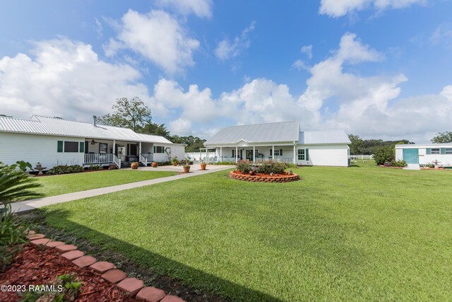 2944 Main Hwy, Breaux Bridge, LA 70517 - view of grassy yard featuring a porch