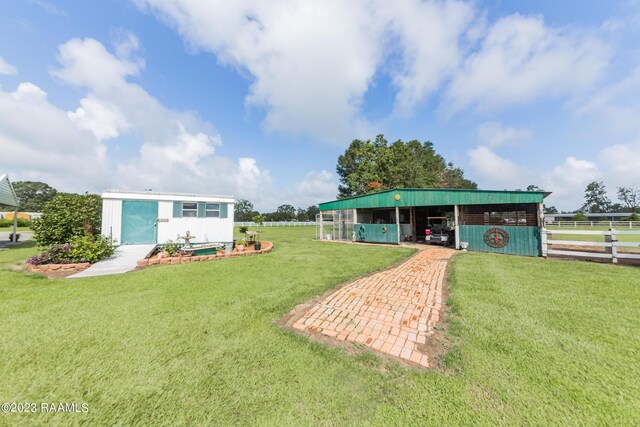 2944 Main Hwy, Breaux Bridge, LA 70517 - view of yard featuring an outdoor structure and an outbuilding