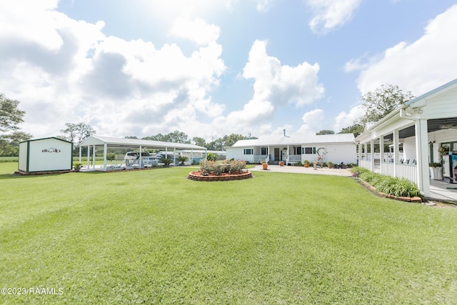 2944 Main Hwy, Breaux Bridge, LA 70517 - view of green lawn with a detached carport