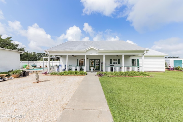 2944 Main Hwy, Breaux Bridge, LA 70517 - view of front of property with a ceiling fan, covered porch, and metal roof