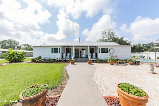 2944 Main Hwy, Breaux Bridge, LA 70517 - single story home with metal roof and a porch