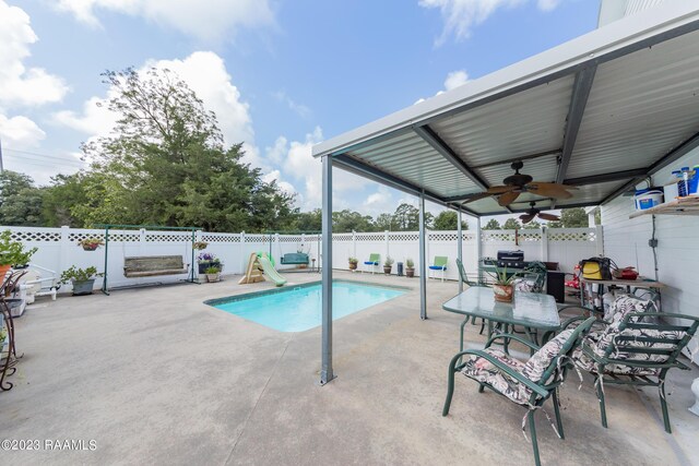 2944 Main Hwy, Breaux Bridge, LA 70517 - view of swimming pool featuring a patio, a ceiling fan, and a fenced backyard