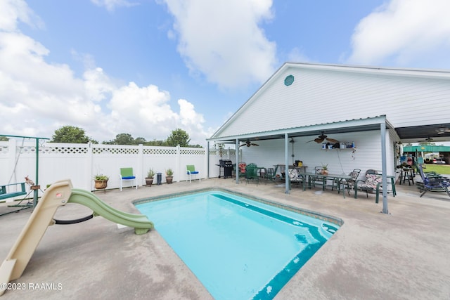 2944 Main Hwy, Breaux Bridge, LA 70517 - view of swimming pool featuring ceiling fan, a patio, and a water slide