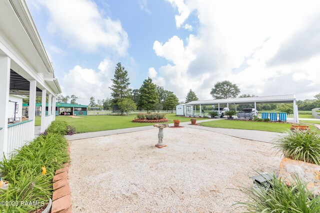 2944 Main Hwy, Breaux Bridge, LA 70517 - view of yard featuring a patio area and concrete driveway