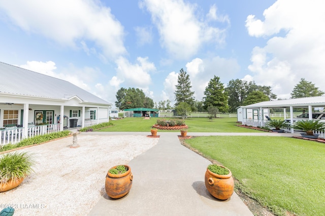 2944 Main Hwy, Breaux Bridge, LA 70517 - view of green lawn with a patio