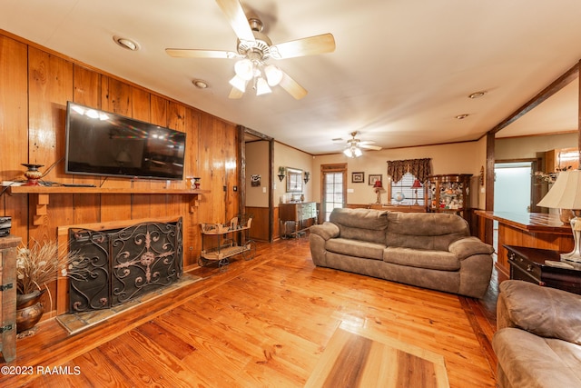 2944 Main Hwy, Breaux Bridge, LA 70517 - living area featuring ceiling fan, wood walls, and wood finished floors
