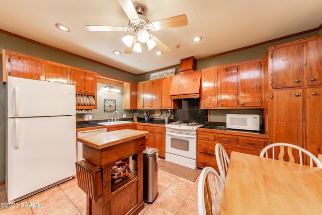 2944 Main Hwy, Breaux Bridge, LA 70517 - kitchen featuring white appliances, a sink, custom range hood, backsplash, and a ceiling fan