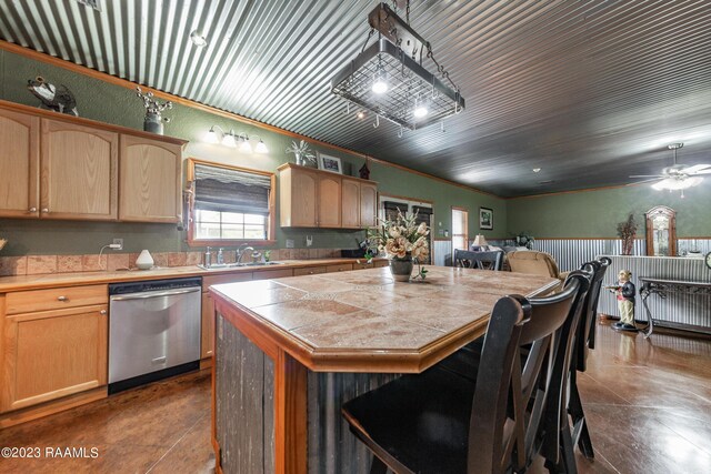 2944 Main Hwy, Breaux Bridge, LA 70517 - kitchen featuring stainless steel dishwasher, a sink, a center island, a breakfast bar, and finished concrete flooring