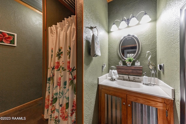 2944 Main Hwy, Breaux Bridge, LA 70517 - bathroom featuring vanity, a textured wall, and a shower with curtain