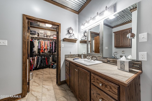 2944 Main Hwy, Breaux Bridge, LA 70517 - bathroom with vanity, backsplash, crown molding, and a spacious closet