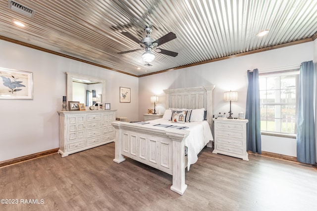 2944 Main Hwy, Breaux Bridge, LA 70517 - bedroom featuring ornamental molding, baseboards, wood finished floors, recessed lighting, and ceiling fan