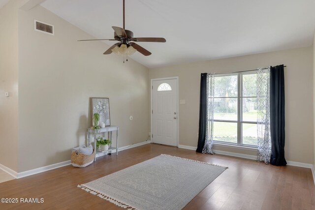 213 Marilyn Dr, Lafayette, LA 70503 - entrance foyer featuring ceiling fan, wood finished floors, high vaulted ceiling, and baseboards