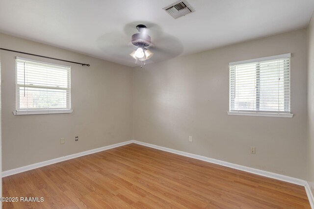 213 Marilyn Dr, Lafayette, LA 70503 - unfurnished room featuring plenty of natural light, light wood-style flooring, and a ceiling fan