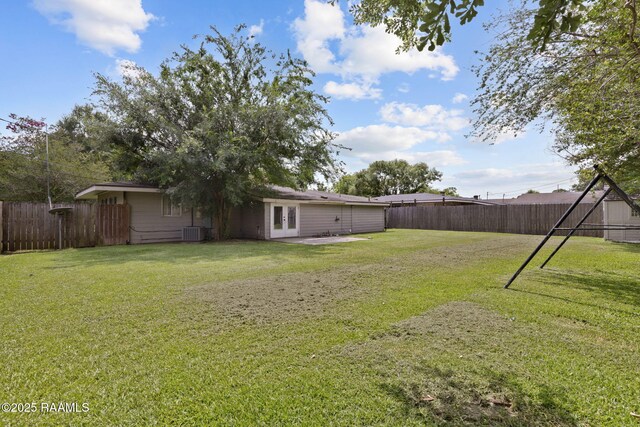 213 Marilyn Dr, Lafayette, LA 70503 - view of yard featuring central AC unit and french doors