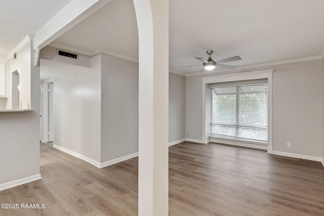 220 Doucet Rd Unit 230D, Lafayette, LA 70506 - spare room featuring crown molding, ceiling fan, and wood finished floors