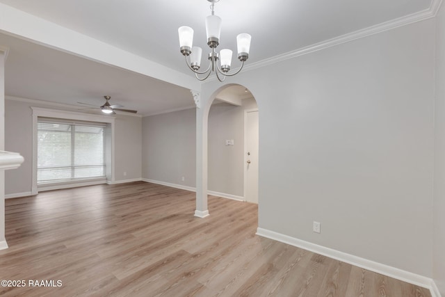 220 Doucet Rd Unit 230D, Lafayette, LA 70506 - spare room featuring arched walkways, ornamental molding, ceiling fan, light wood finished floors, and a chandelier