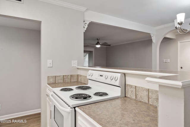 220 Doucet Rd Unit 230D, Lafayette, LA 70506 - kitchen featuring white range with electric stovetop, ceiling fan, ornamental molding, light countertops, and a peninsula