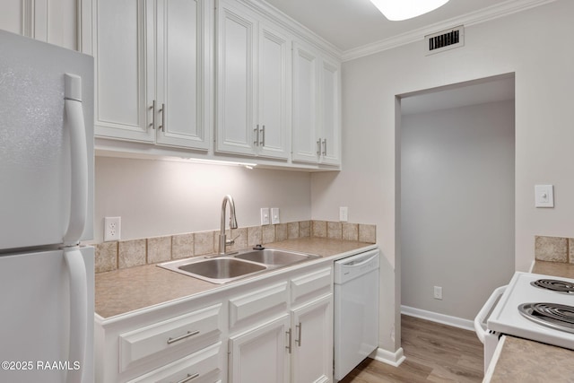 220 Doucet Rd Unit 230D, Lafayette, LA 70506 - kitchen featuring white appliances, white cabinetry, light countertops, light wood-style flooring, and crown molding
