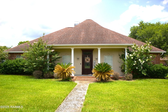 101 David St, Breaux Bridge, LA 70517 - view of front of home featuring roof with shingles, a front yard, stucco siding, and a porch