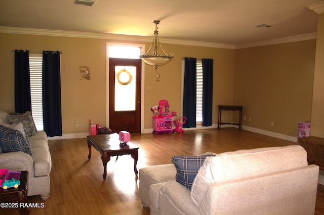 101 David St, Breaux Bridge, LA 70517 - living area with wood finished floors, ornamental molding, and baseboards