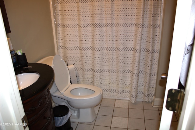101 David St, Breaux Bridge, LA 70517 - full bathroom with vanity, tile patterned flooring, toilet, and a shower with shower curtain