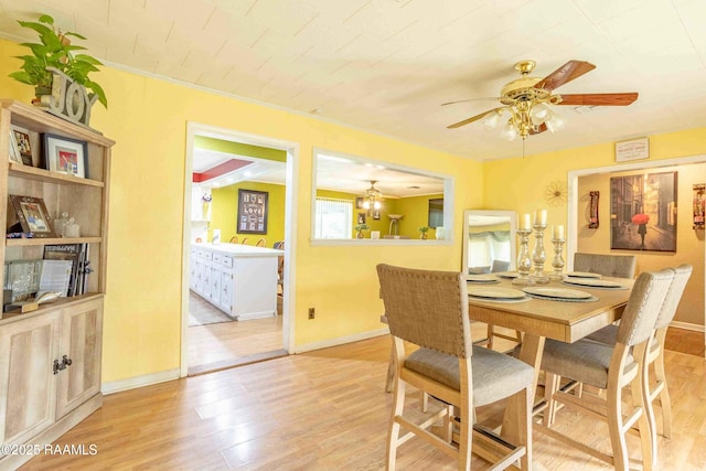 617 Sidney Dr, Breaux Bridge, LA 70517 - dining space with wood finished floors, ceiling fan, and baseboards