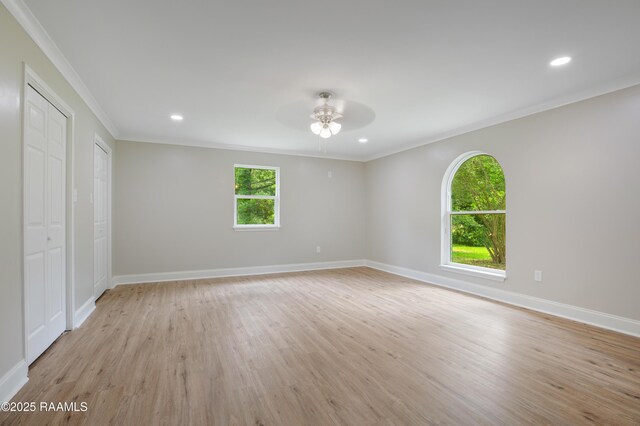 5811 Basile Eunice Hwy, Eunice, LA 70535 - unfurnished bedroom featuring crown molding, light wood-style flooring, baseboards, recessed lighting, and a ceiling fan
