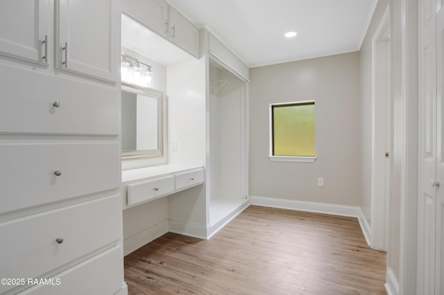 5811 Basile Eunice Hwy, Eunice, LA 70535 - unfurnished bedroom featuring light wood-style flooring, baseboards, recessed lighting, a desk, and a closet