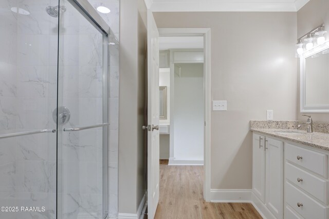 5811 Basile Eunice Hwy, Eunice, LA 70535 - full bathroom featuring a marble finish shower, vanity, and wood finished floors