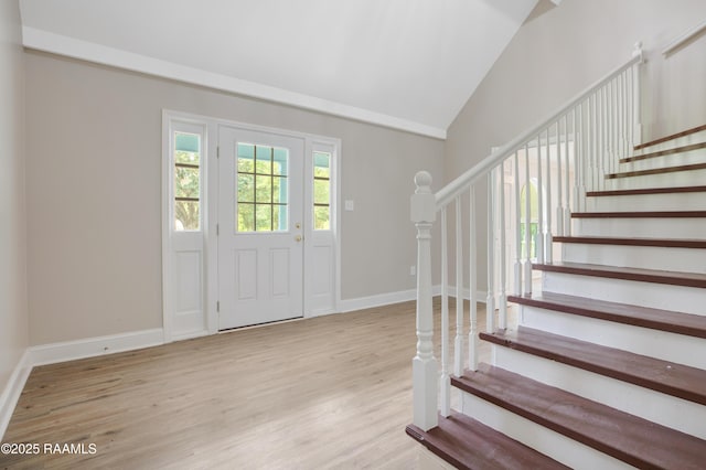 5811 Basile Eunice Hwy, Eunice, LA 70535 - entryway with stairway, wood finished floors, baseboards, and vaulted ceiling