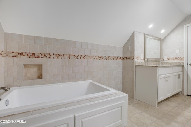 5811 Basile Eunice Hwy, Eunice, LA 70535 - bathroom with vaulted ceiling, vanity, a garden tub, and tile walls