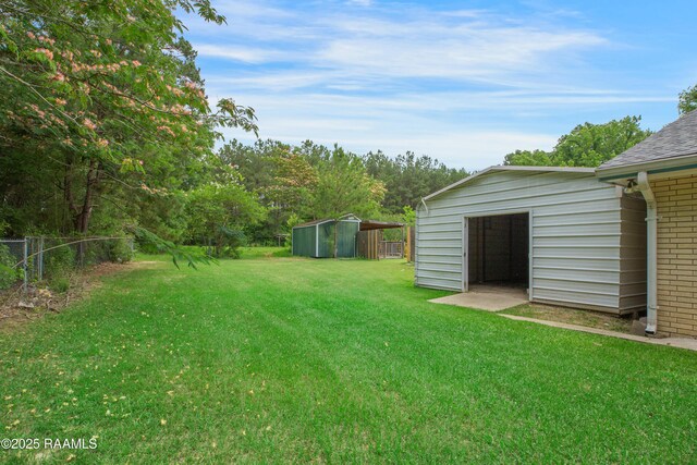 5811 Basile Eunice Hwy, Eunice, LA 70535 - view of yard featuring an outbuilding and a garage