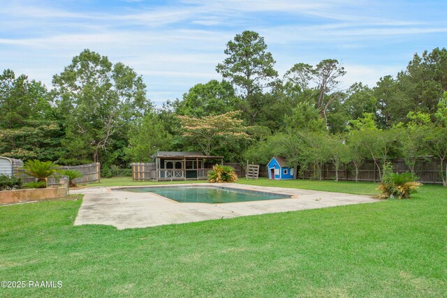 5811 Basile Eunice Hwy, Eunice, LA 70535 - view of pool with an outdoor structure, a patio, and a storage structure