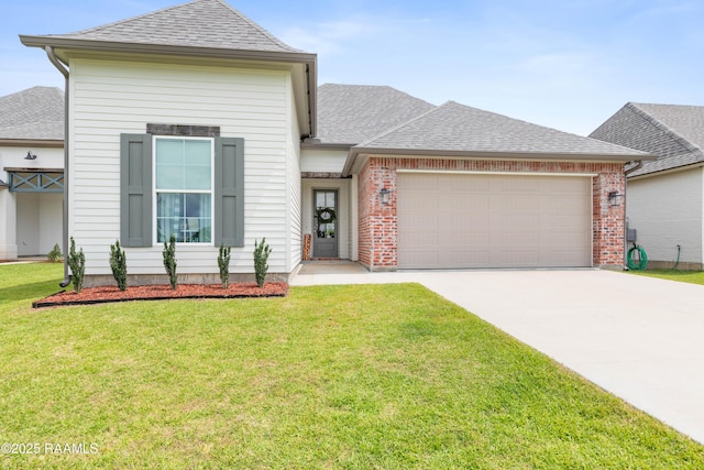 213 Octavia Dr, Scott, LA 70583 - view of front of property featuring an attached garage, concrete driveway, a shingled roof, and a front yard