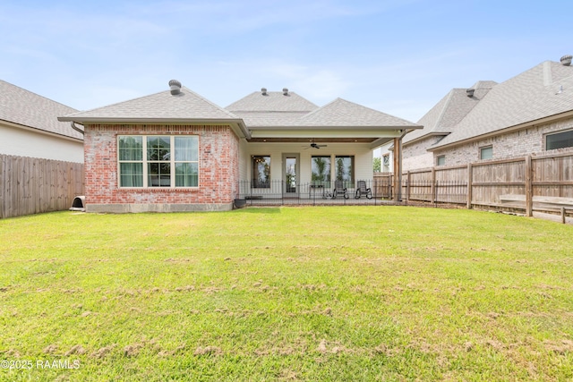213 Octavia Dr, Scott, LA 70583 - back of house featuring ceiling fan, a shingled roof, brick siding, and a patio